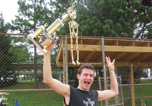The Bones Brigade skeleton mascot latches onto their trophy