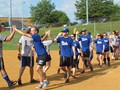 Post-game handshakes demonstrate team sportsmanship.